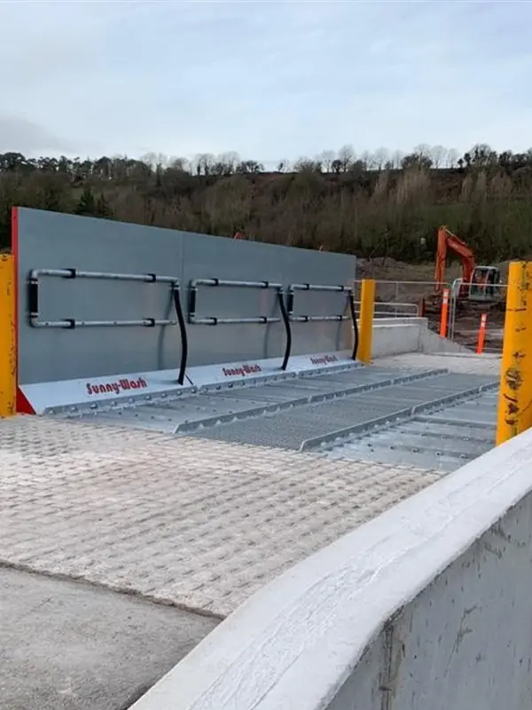 Surface mounted SiteWash wheel wash at a concrete site entrance