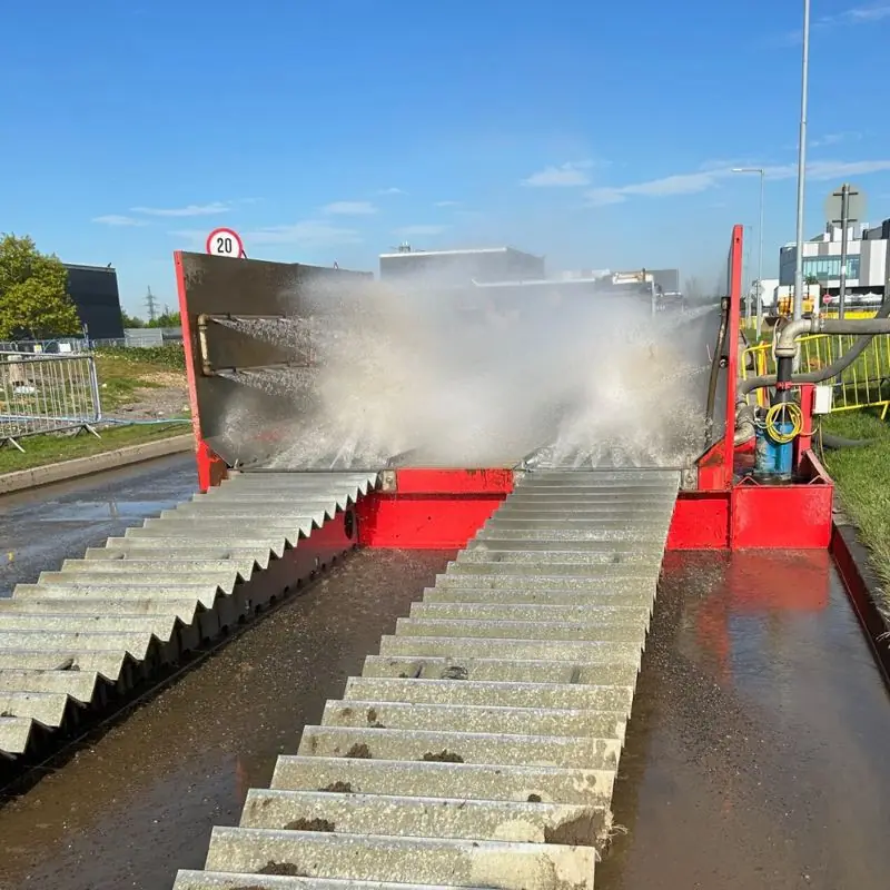 SiteWash surface mounted wheel wash washing a truck